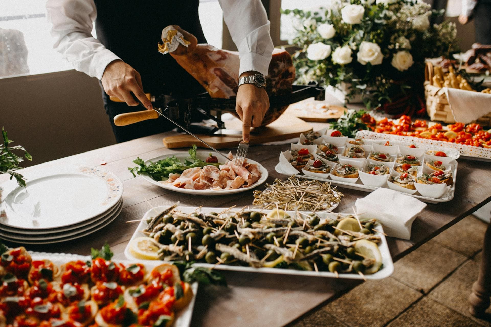 Waterproof canopy covering food stations at outdoor Kerala wedding